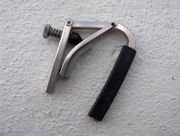 A Shubb capo which uses a cam-operated clamp